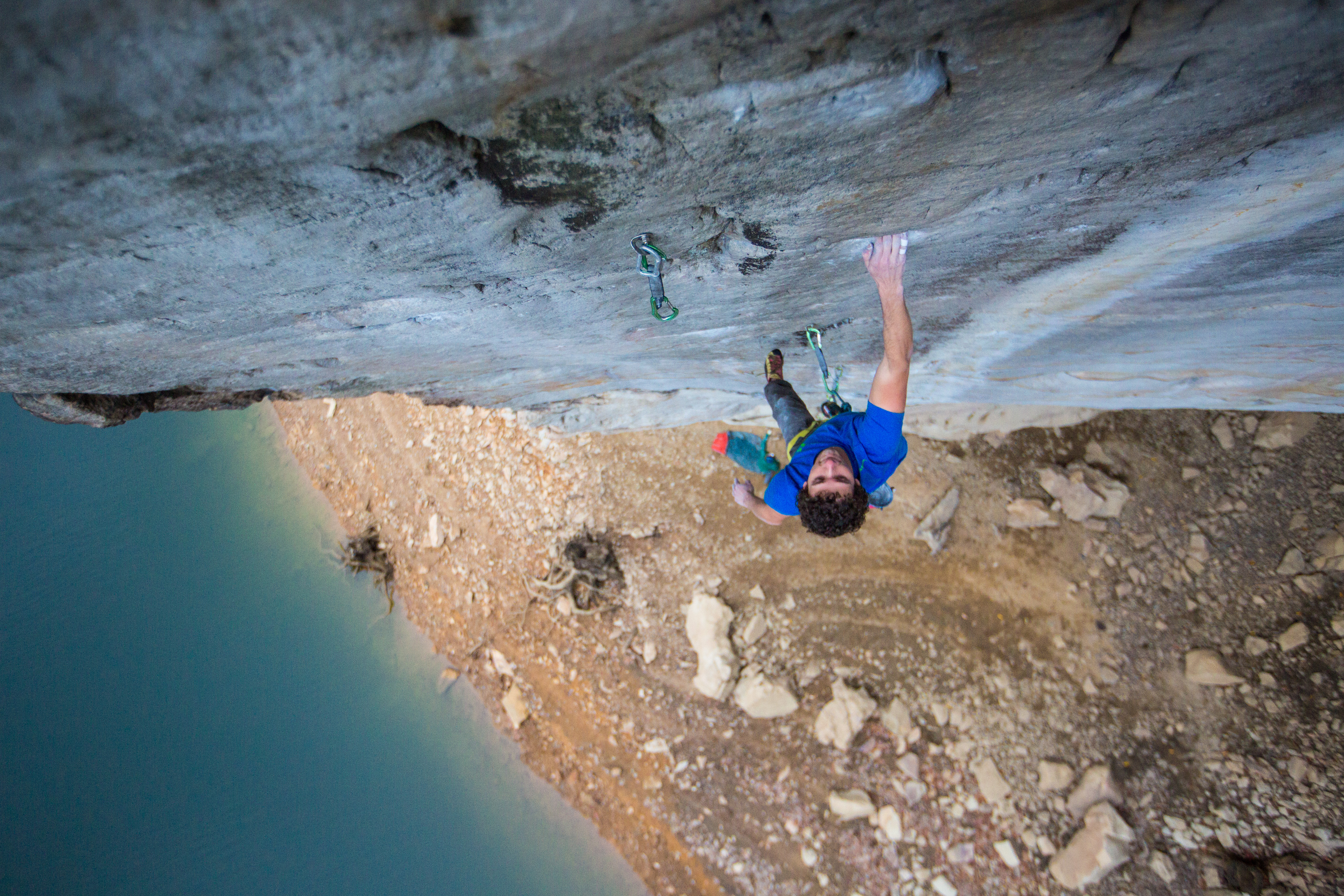 Tyler Wilcut tickling the crux dyno on an undone project in West Virginia's New River Gorge.